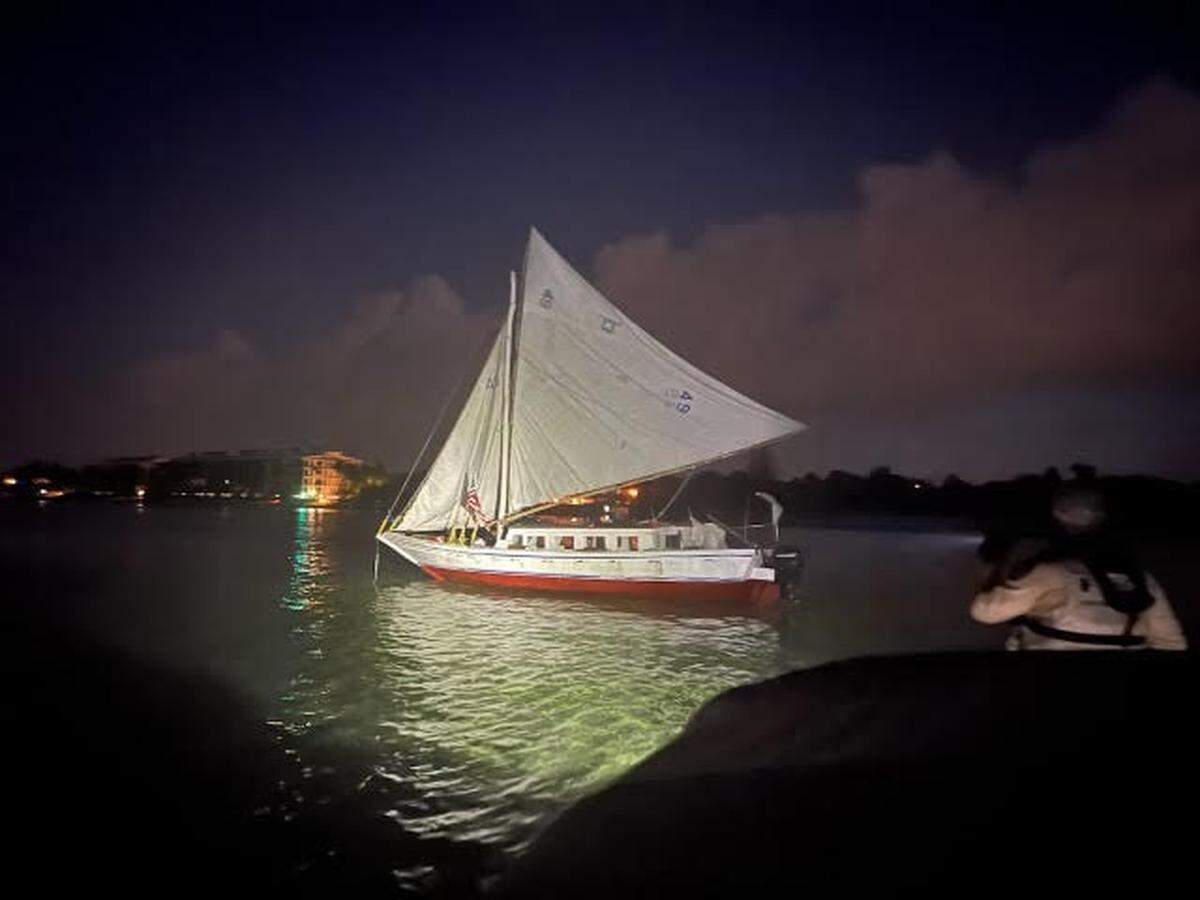 A sailboat that brought about 120 Haitian migrants to Key West, Fla., on Wednesday morning, June 26, 2024, sits near Higgs Beach.