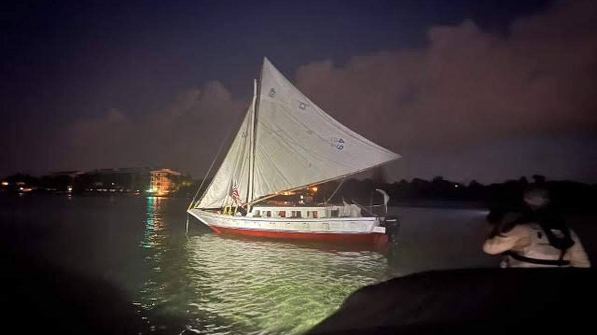 A sailboat that brought about 120 Haitian migrants to Key West Wednesday morning, June 26, 2024, floats in the water near Higgs Beach.