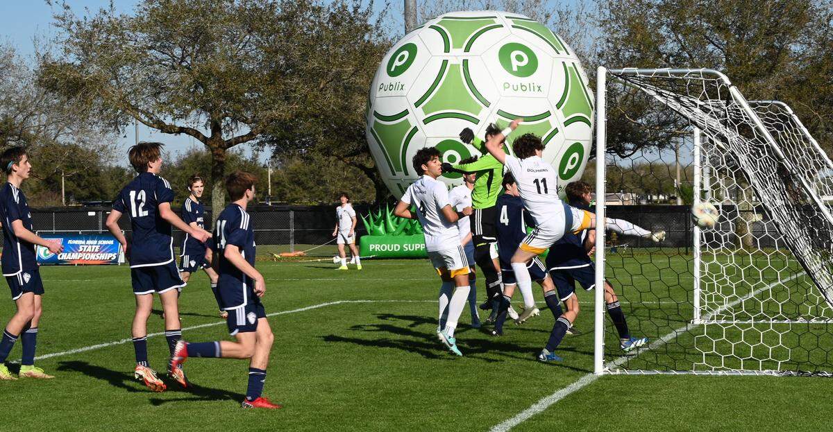 Santigao Ramos (8) watches from 30-yards away as his free kick sails between Maclay defenders and goalkeeper to find a home in the back of the net, which tied the Class 3A state semifinal game 1-1 on Wednesday at Lake Myrtle Park in Auburndale.