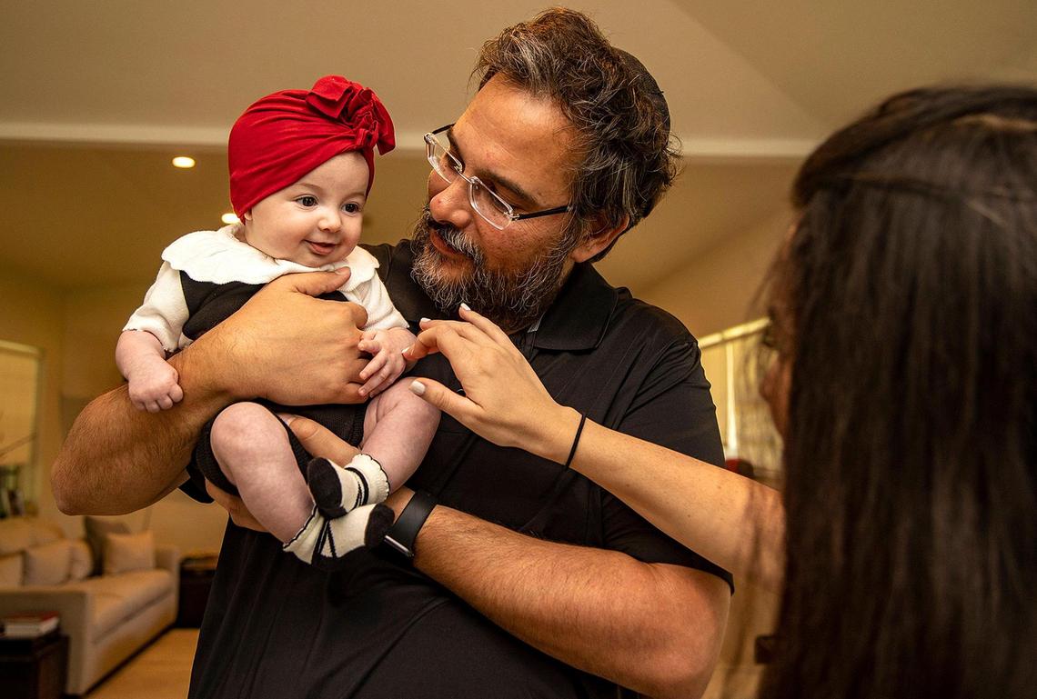 Sheva and her husband, Dovy Ainsworth, with their 3-month-old daughter, Ita, who was born on June 23, the day before the Champlain Towers South condo collapse. Dovy’s parents, ‘Itty’ and Tzvi Ainsworth, were killed in the collapse. Ita was named after her grandmother Ingrid, whose Hebrew name is Ita and who went by the nickname ‘Itty.’