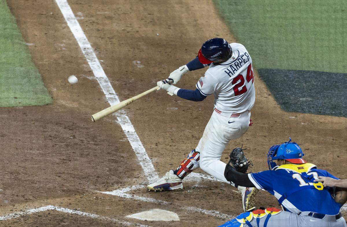 United States first baseman Bryce Harper (24) hits a home run against Venezuela in the eighth inning of their World Baseball Classic final game at loanDepot Park on Tuesday, March 17, 2026, in Miami, Fla.