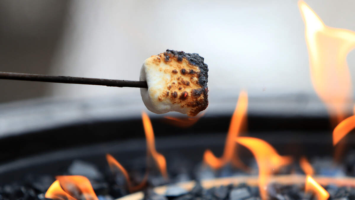Guests make smores during the Team USA Media Summit opening reception at the Red Pine Lodge on September 24, 2017 in Park City, Utah.