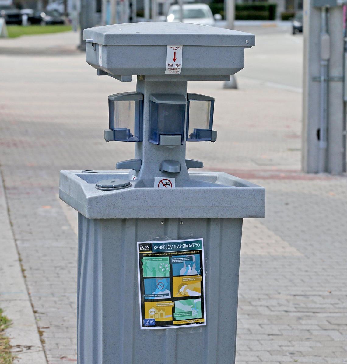 The city of Miami has installed hand-washing stations, like this one at Biscayne Boulevard and Flagler Street in downtown, and they are being refilled with soap and paper towels.  March 25, 2020. 