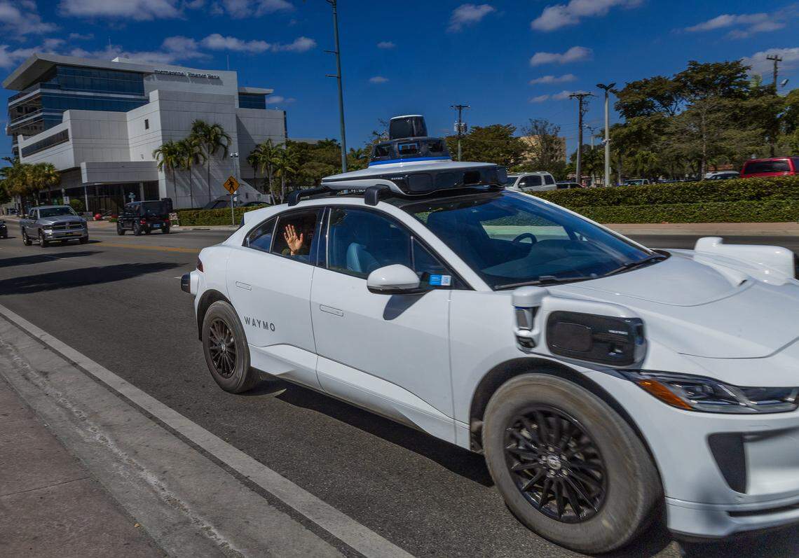 View of a Waymo self driving car at SW 8 Street, with Miami Herald reporters Catherine Odom and Michael Butler, onboard, as they head to the Brickell Centre, to test the Waymo-Self-Driving Cars - Autonomous Vehicles - Ride-,on Wednesday, February 25, 2026.