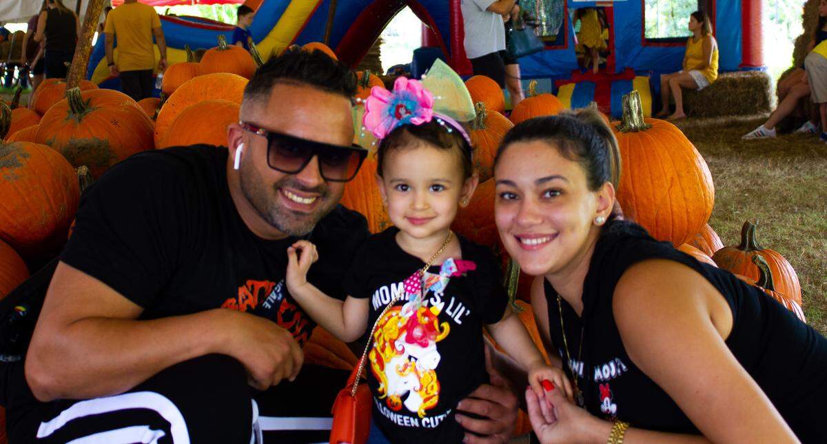 Fabian Cardo and Massiel Soto with their daughter, Megan, 18 months, visit The Pumpkin Patch in Kendall the last weekend before Halloween.
