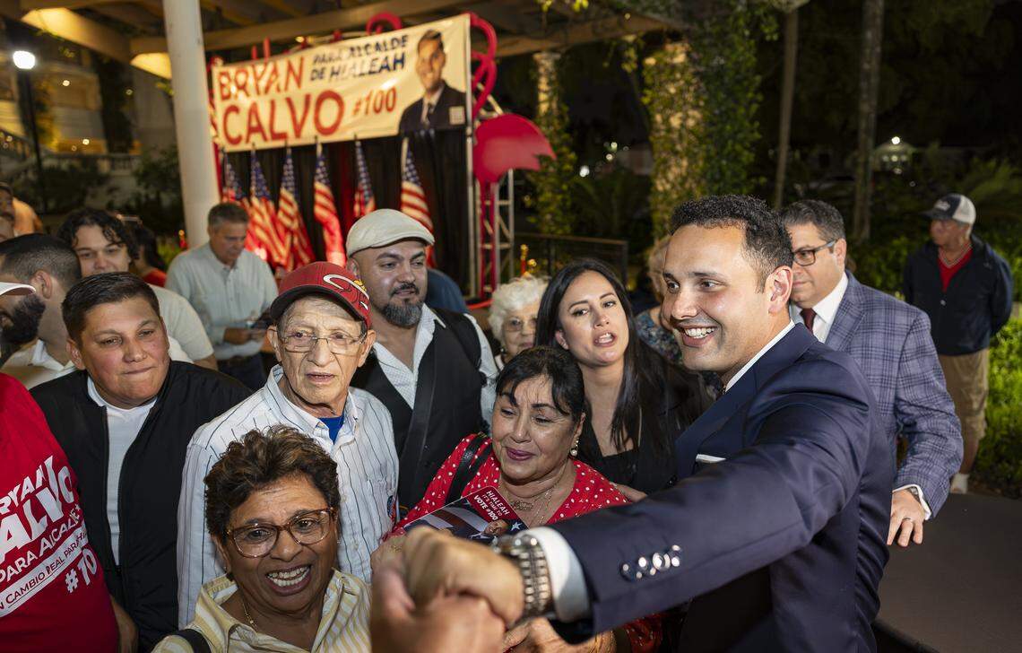 Newly elected Hialeah Mayor Bryan Calvo hugs supporters after defeating Interim Mayor Jackie Garcia-Roves during his election night party at Hialeah Park Casino on Tuesday, Nov. 4, 2025, in Hialeah, Fla.