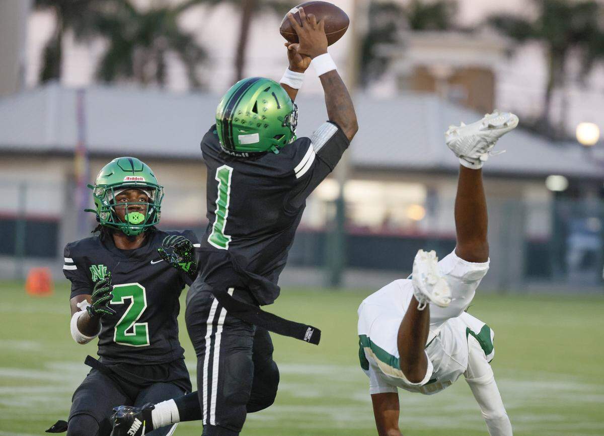 North Miami High School defender Cameron Canon (1) intercepts a Mater Academy pass during their high school football at Milander Stadium in Hialeah, Florida, on Saturday, September 27, 2025.