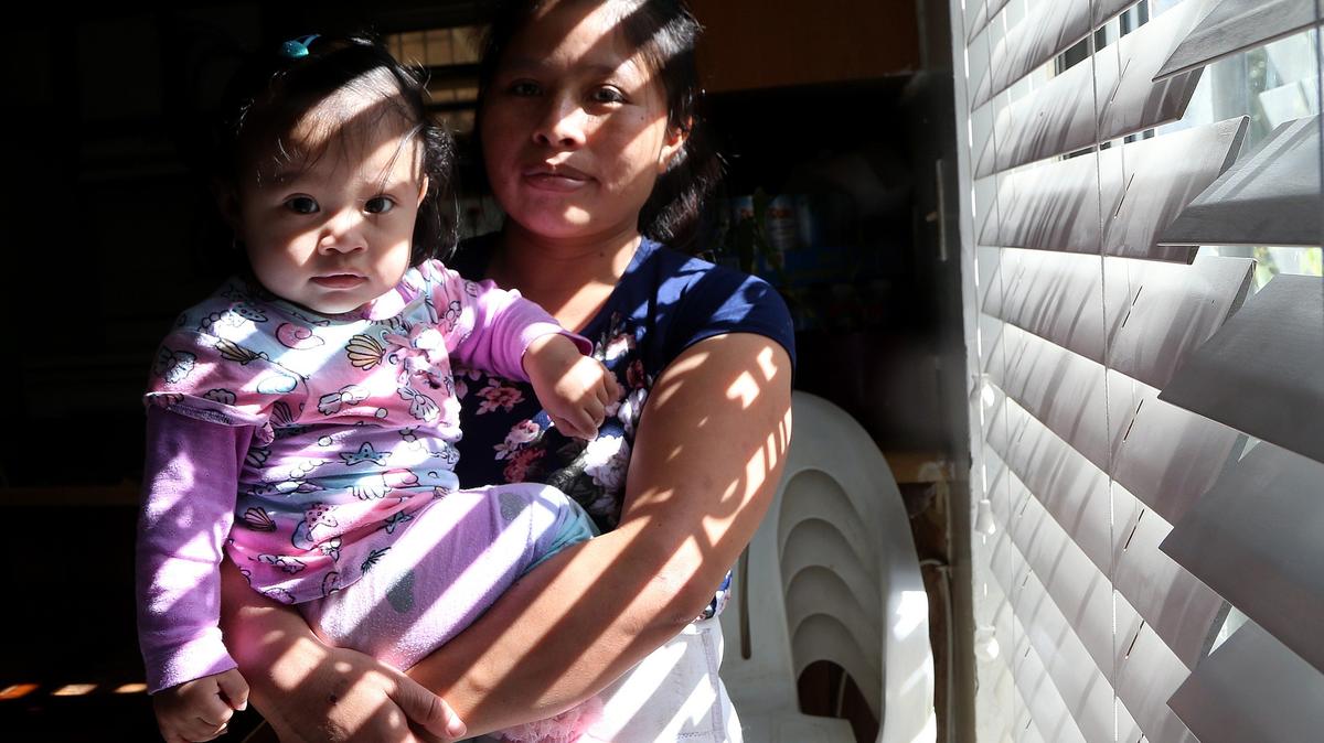 Catarina Gomez and 11-month-old daughter Ruth at home in Florida City on November 26, 2019.