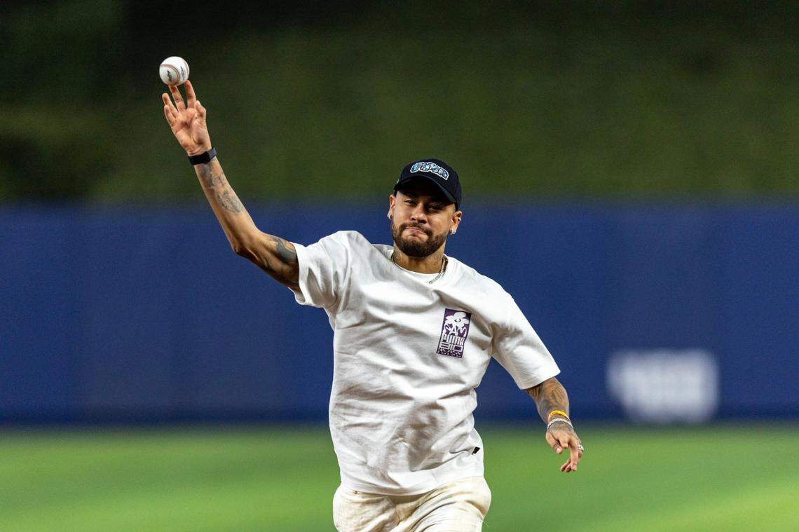 Brazilian soccer player Neymar throws out the first pitch before the first inning of an MLB game against the Pittsburgh Pirates at LoanDepot Park in Miami, Florida, on Thursday, March 28, 2024.
