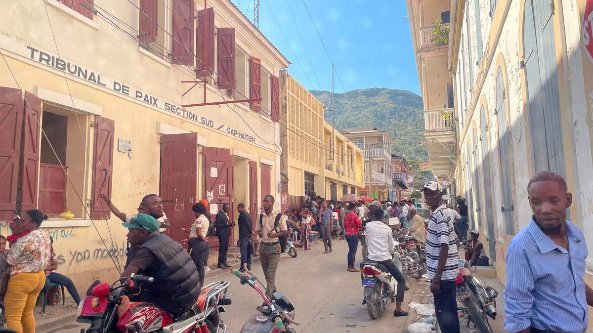 In Cap-Haïtien, where a riot almost broke out shortly after President Biden announced a new parole program for nationals of Haiti and three other countries, people crowd the immigration office on Saturday, Jan. 21, 2023. All are trying to apply for a passport so they can be considered for the program, which requires a financial sponsor in the U.S.