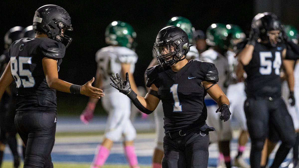 Archbishop Carroll Bulldogs running back Alejandro Isaza (1) celebrates after scoring a touchdown against the Westminster Christian Warriors during the second quarter of a high school football game at Tropical Park on Friday, Oct. 21, 2022, in Miami, Fla.