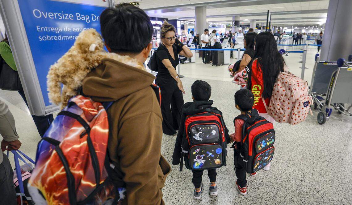 Luisa Gutiérrez escorts seven children to Guatemala on Thursday, Dec. 4, 2025 at Miami International Airport.