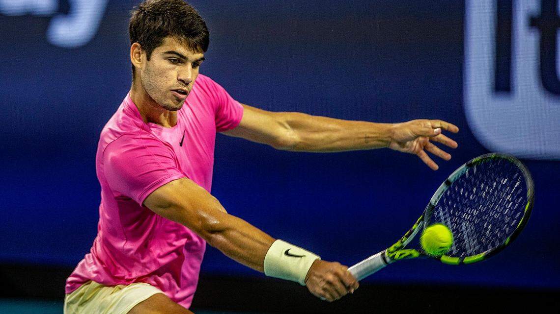 Carlos Alcaraz (SPA), world ranking No. 1, returns against Jannik Sinner (ITA), world ranking No, 9, during the men’s singles semifinals match at the Miami Open tennis tournament in the Hard Rock Stadium in Miami Gardens, on Friday March 31, 2023. Both are contenders again at the 2024 Miami Open.