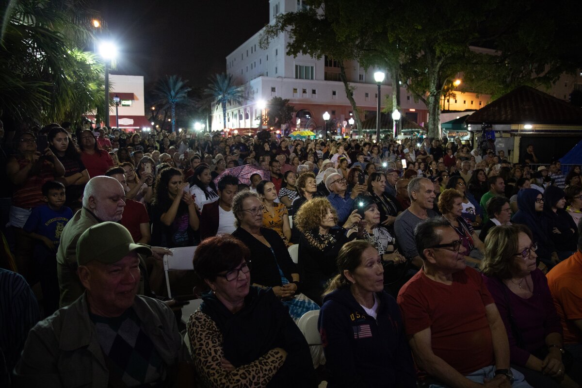 Crowds gathered in the rain during an event hosted by Commissioner Joe Carollo at Calle Ocho in Miami, on Friday, November 30, 2018.