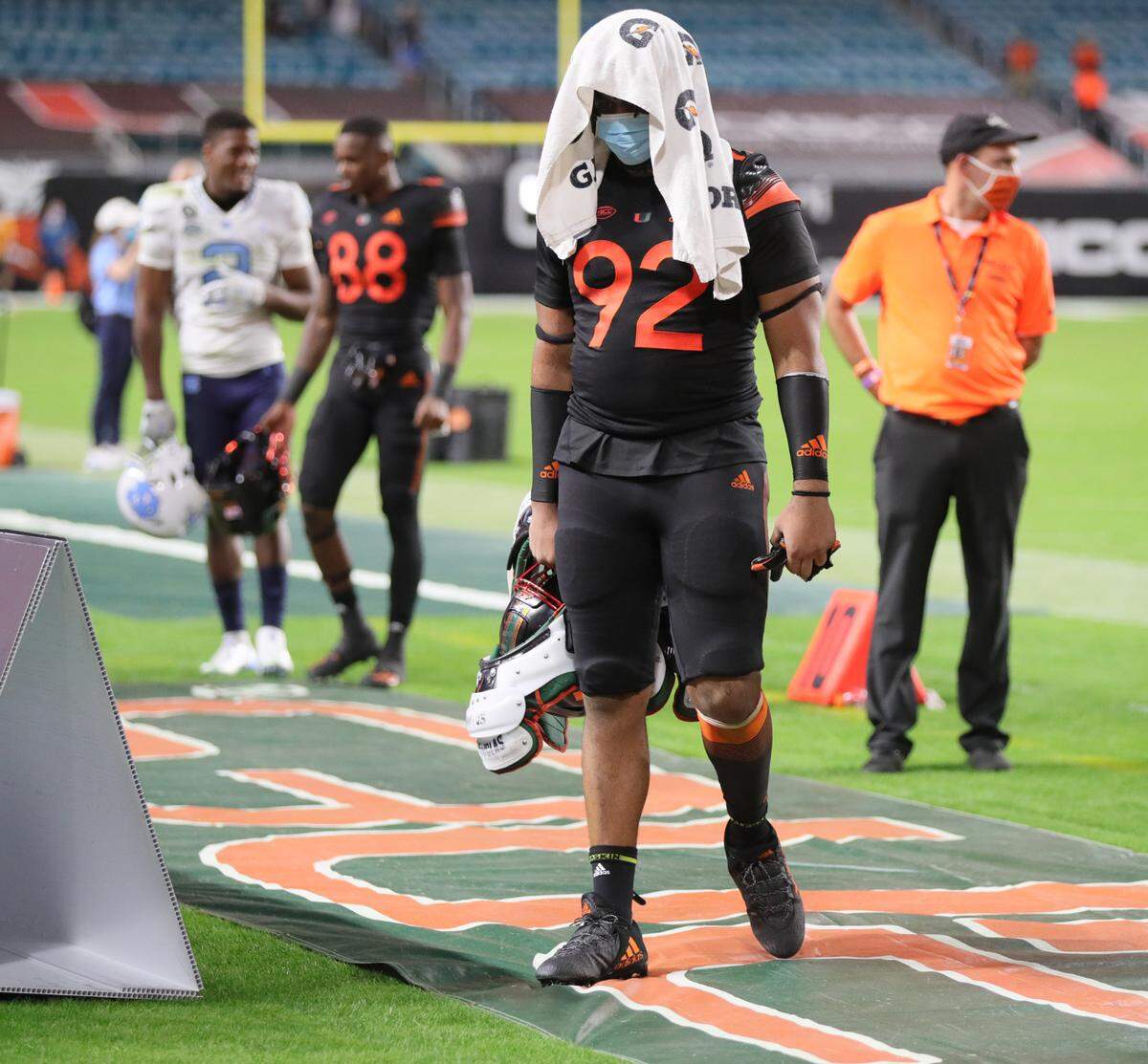 Miami Hurricanes defensive lineman Jason Blissett Jr. (92) walks off the field after a loss to UNC at Hard Rock Stadium in Miami Gardens on Saturday, December 12, 2020.
