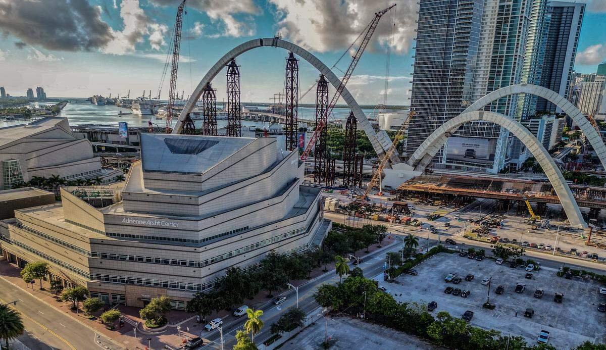 View of the Arsht Center and the ongoing construction of the arches for the I-395 signature bridge as part of the I-395/I-95 Design-Build Project, in Miami, on Saturday, August 16, 2025.