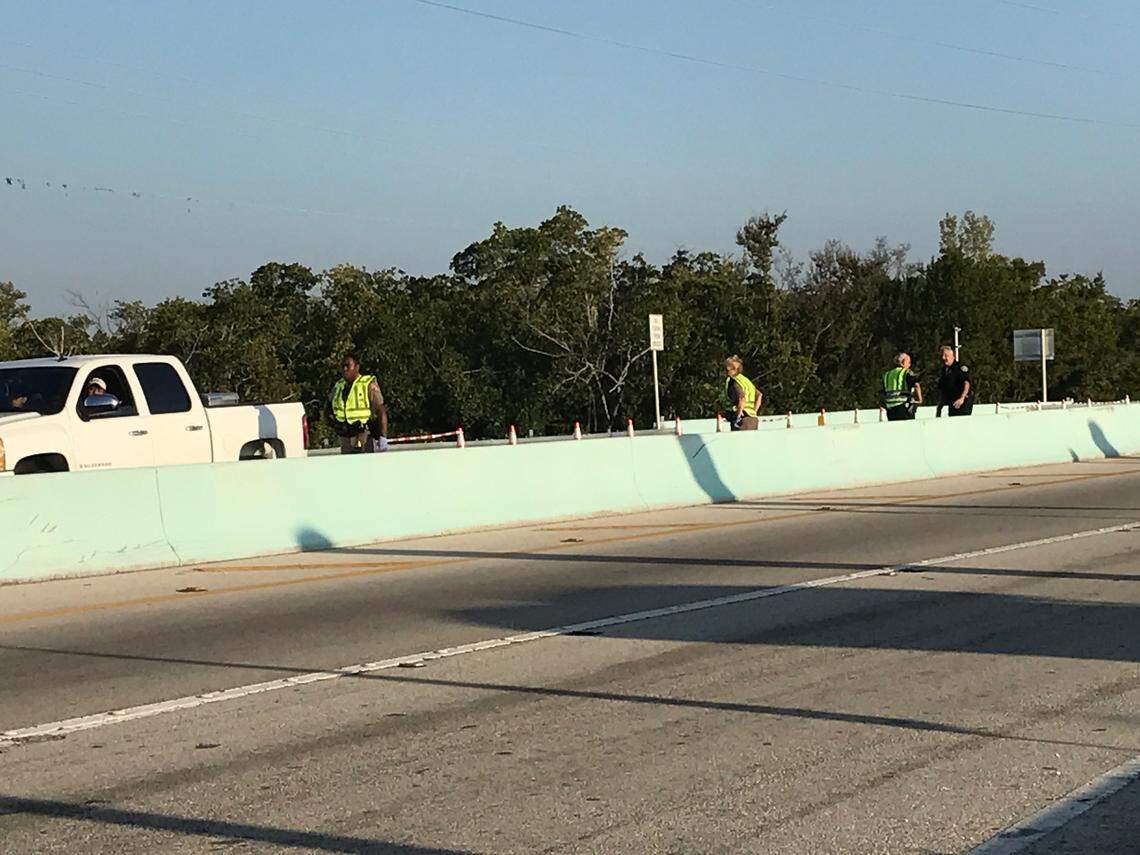 Monroe County Sheriff’s Office deputies and other law enforcement officers staff a checkpoint on the 18 Mile Stretch of U.S. 1 leading to the Florida Keys Friday, March 27, 2020.