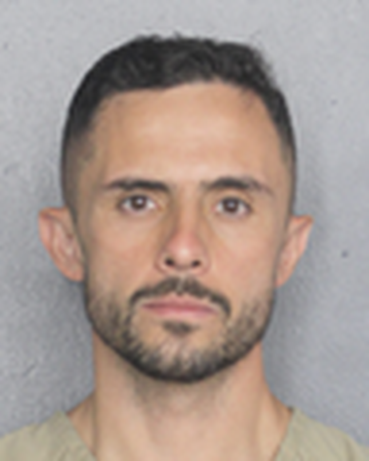 Heriberto Martinez, 36, the former associate director of engineering at Jackson Health Systems, was taken into custody in Broward County Tuesday morning and is charged with taking part in a scheme in which he exchanged construction jobs for cash, trips and football tickets.