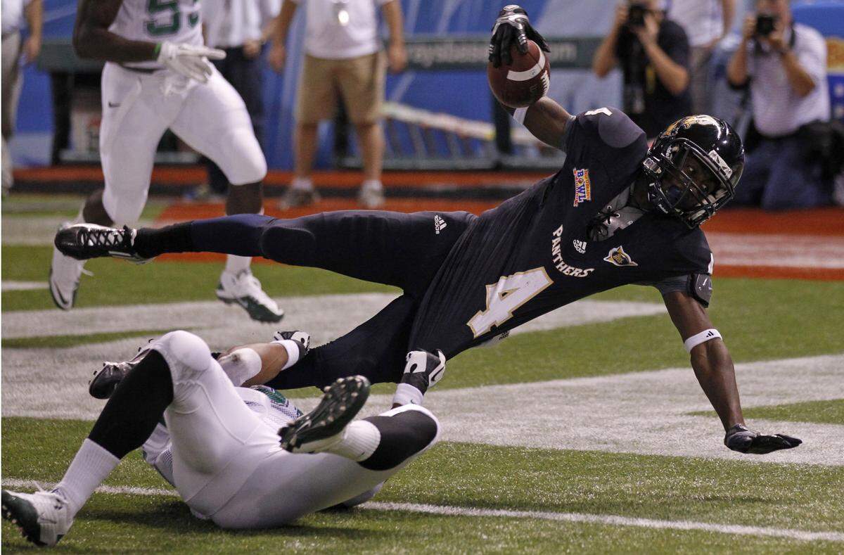 Florida International University's Wide Receiver T.Y. Hilton scores a touch down in the first quarter during Florida International University Panthers vs Marshall Thundering Herd for the Beef 'O' Brady's Bowl at Tropicana Field in St. Petersburg on Tuesday, December 20, 2011.