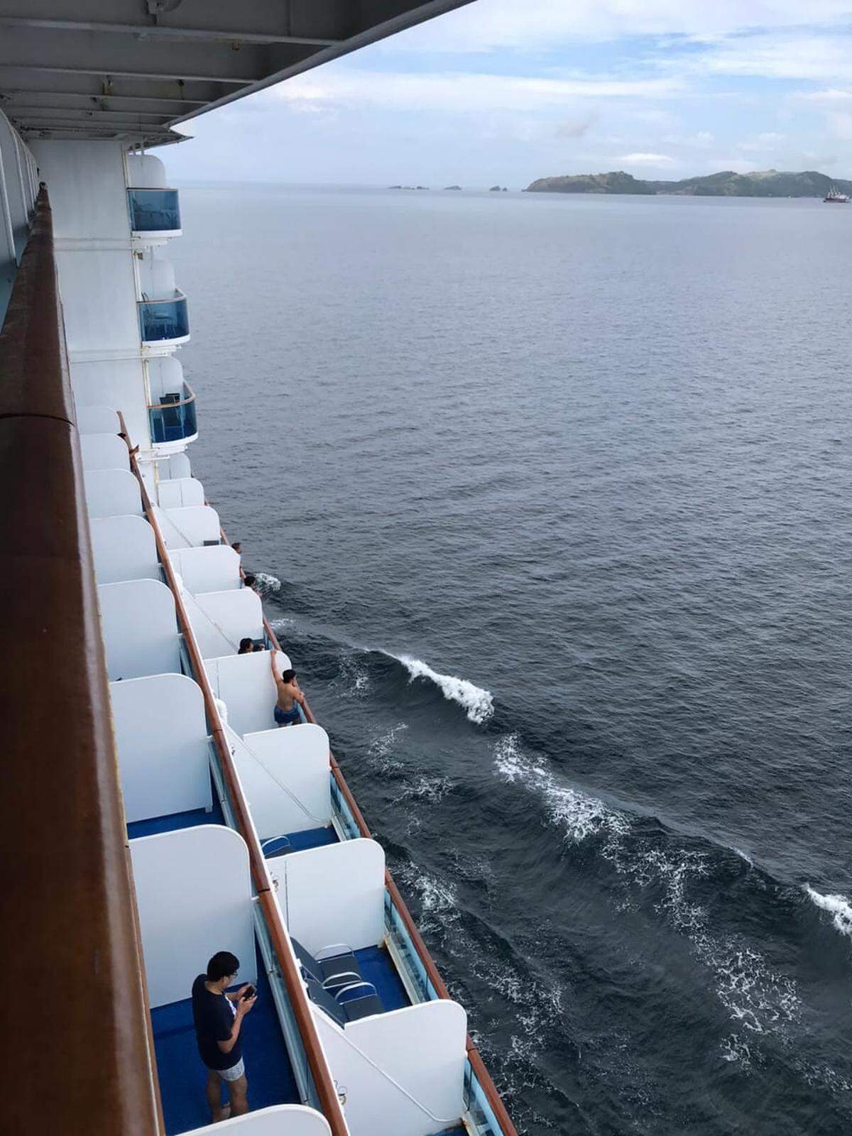Crew members aboard the Island Princess cruise ship wait to be repatriated off of Manila, Philippines in July 2020.