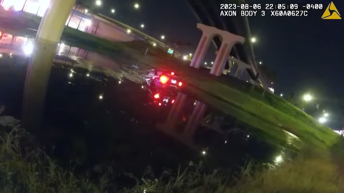 Florida police officers jumped into the water to save a driver who crashed into the retention pond, body camera footage showed.