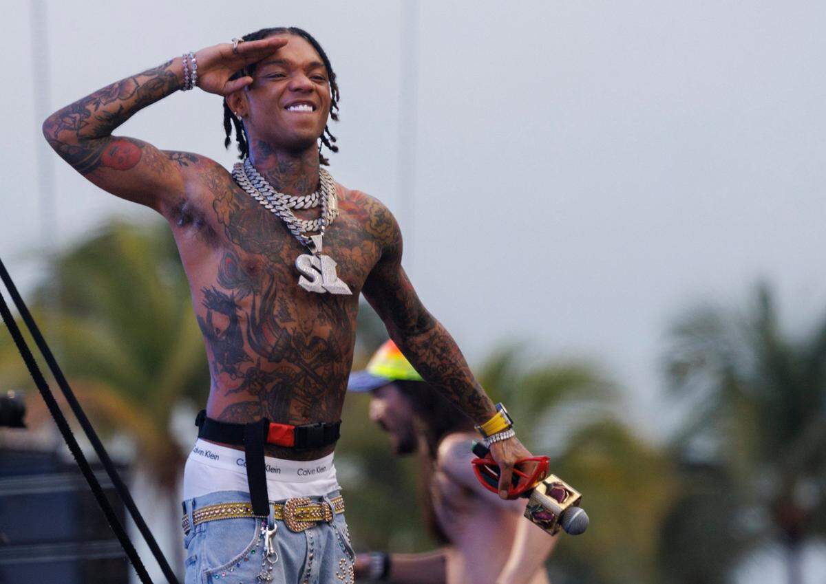 Swae Lee waves to fans after getting brought on stage as a guest DJ Steve Aoki on the Main Stage during the third day of Ultra Music Festival on Sunday, March 30, 2025, at Bayfront Park in downtown Miami, Fla. 