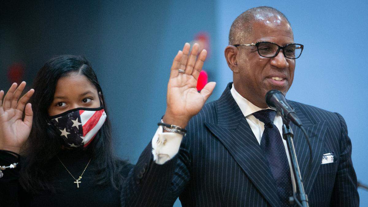 Dr. Steve Gallon III is sworn in to the Miami-Dade School Board. Standing behind him is his granddaughter, Kailee Gallon, on Nov. 17, 2020.
