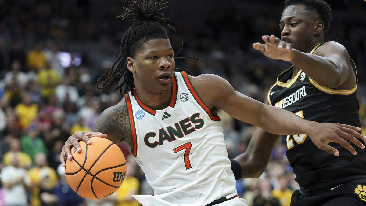 ST LOUIS, MISSOURI - MARCH 20: Shelton Henderson #7 of the Miami (FL) Hurricanes drives the ball against Mark Mitchell #25 of the Missouri Tigers during the second half in the first round of the 2026 NCAA Men's Basketball Tournament at Enterprise Center on March 20, 2026 in St Louis, Missouri. (Photo by Jamie Squire/Getty Images)