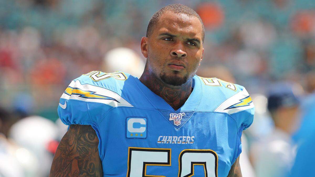 Los Angeles Chargers center Mike Pouncey looks on before the start of an NFL football game against the Miami Dolphins at Hard Rock Stadium on Sunday, September 29 2019, in Miami Gardens.