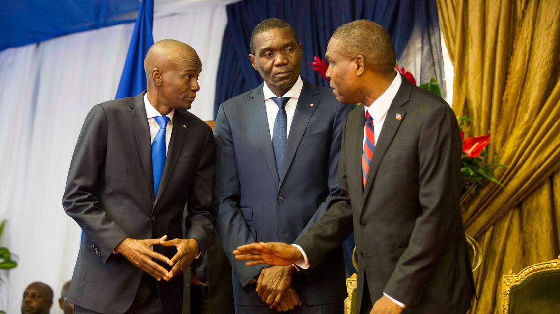 On Aug. 7, 2018, Haiti Senate President Joseph Lambert, center, speaks with Jean-Henry Ceant, then the prime minister, and President Jovenel Moïse, left. Lambert said Friday evening that his fellow senators have elected him president in the aftermath of Moïse’s assassination.