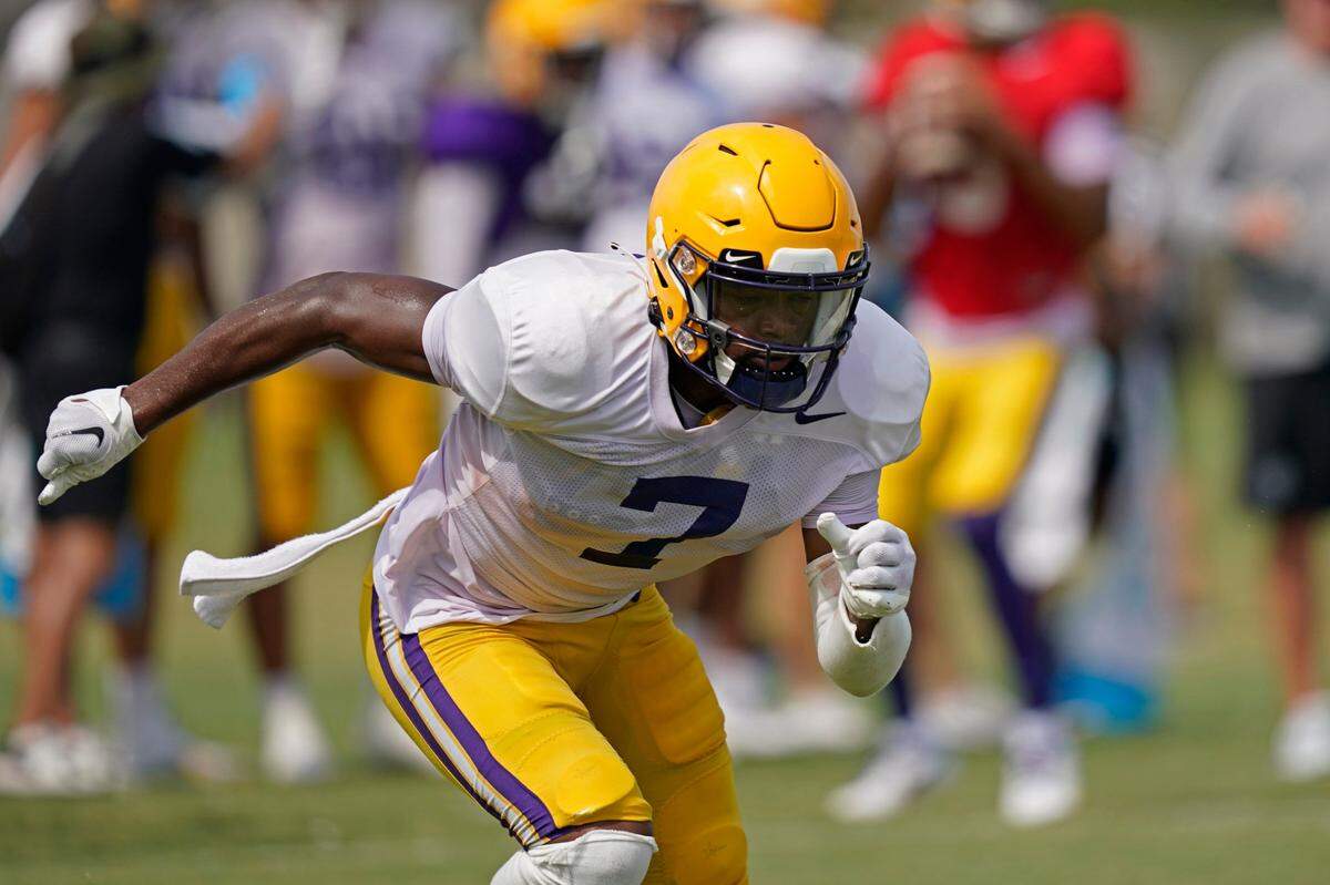 FILE - LSU wide receiver Kayshon Boutte (7) runs through drills during their NCAA college football practice in Baton Rouge, La., Wednesday, Aug. 17, 2022. Boutte was selected to The Associated Press preseason All-America team Monday, Aug. 22, 2022. (AP Photo/Gerald Herbert, File)