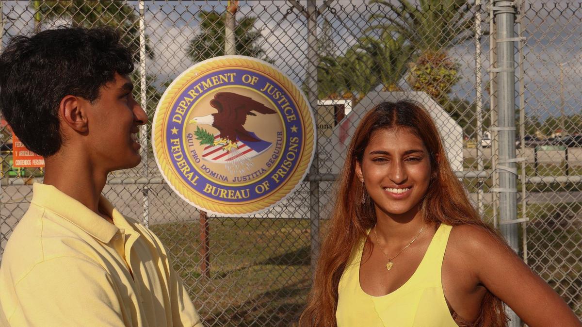 Brother and sister, Joshua, left, and Ava Martoma, right, founders of the non-profit KidsMates are photographed at the Federal Correction Institution in southwest Miami-Dade where their father was once incarcerated.