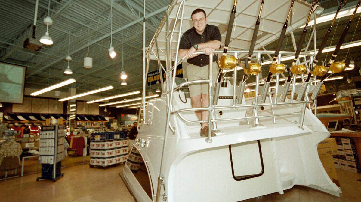 General Manager Erik Rimblas poses in a West Marine store in Fort Lauderdale on June 19, 2003. West Marine says it will be closing a number of stores.