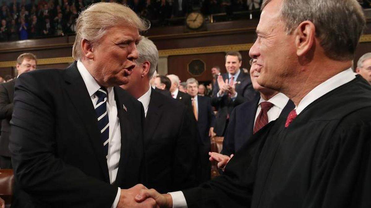 Supreme Court Chief Justice John Roberts, left, criticized President Trump’s contention that judges are politically partisan.