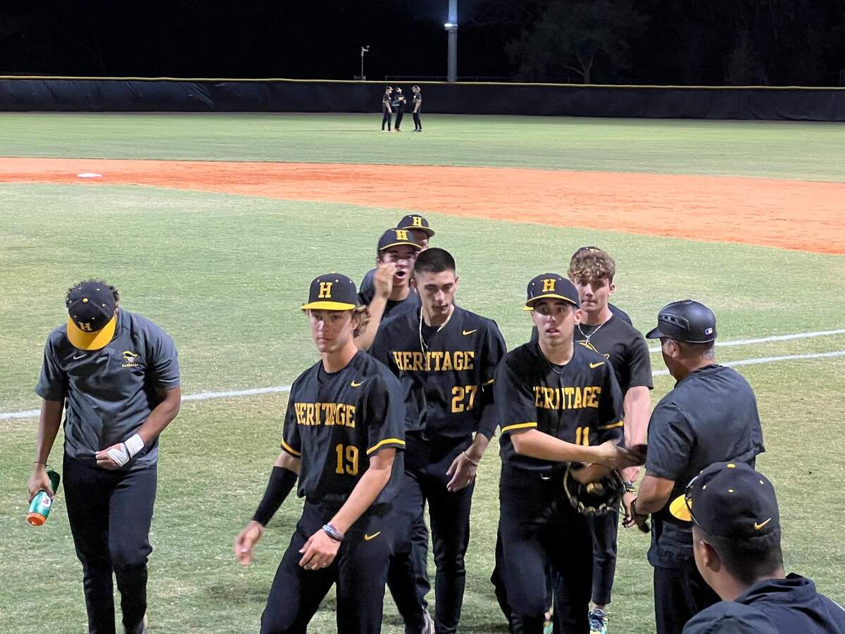 American Heritage starter Spencer Krasner and his teammates walk off the field in between innings during their win over Pembroke Pines Charter in the Region 4-5A semifinals on Friday night at Heritage. Krasner struck out 11.