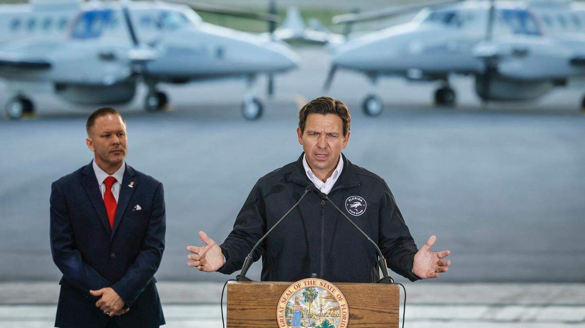 Florida Gov. Ron DeSantis speaks at a media conference at the Homestead Air Reserve Base alongside Department of Homeland Security Senior Counselor Keith Pearson in Homestead, Florida on Wednesday, Feb. 26, 2025.