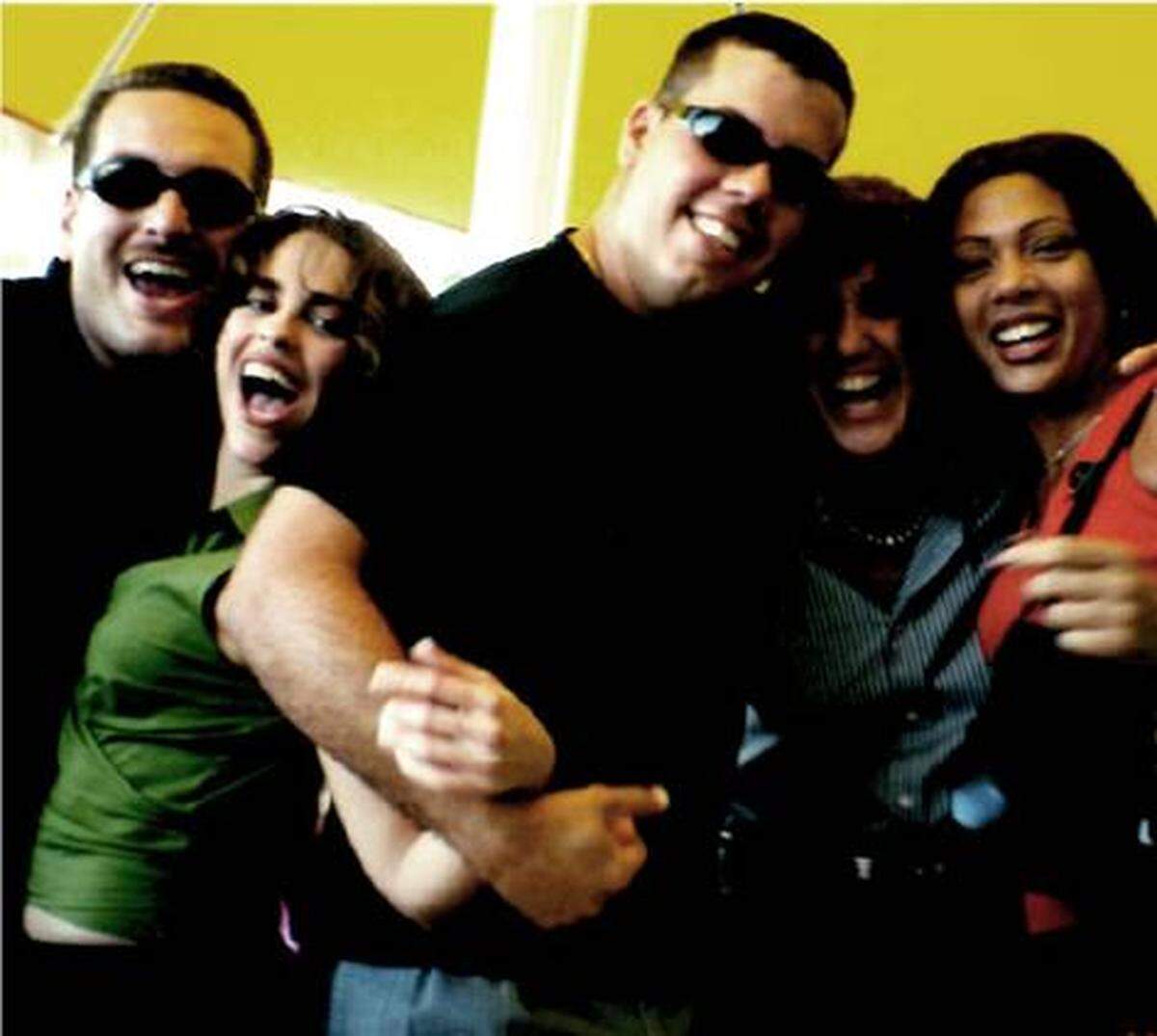Elena Blasser, second from right, and Ody Lugo, second from left, celebrate the last day of the school year with other staff from Zora Neale Hurston Elementary School at a nearby restaurant.