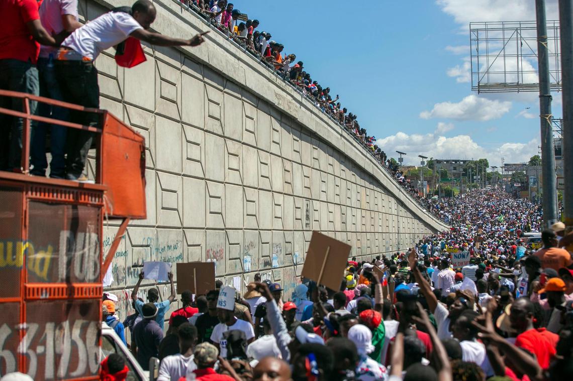 People protest to demand the resignation of Haitian President Jovenel Moise in Port-au-Prince, Haiti, Sunday, Feb. 28, 2021. The opposition is disputing the mandate of President Moise whose term they claim ended on Feb. 7, but the president and his supporters say his five-year term only expires in 2022.