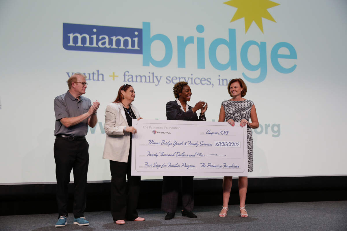 Celebrating a grant to help Miami Bridge Youth & Family Services are, from left: Peter Schneider, Primerica president; Wendy Mitchell, Miami Bridge Licensed Clinical Social Worker; Dorcas Wilcox, CEO of Miami Bridge; and Kathryn Kieser, Primerica executive vice president and chairwoman of the Primerica Foundation.