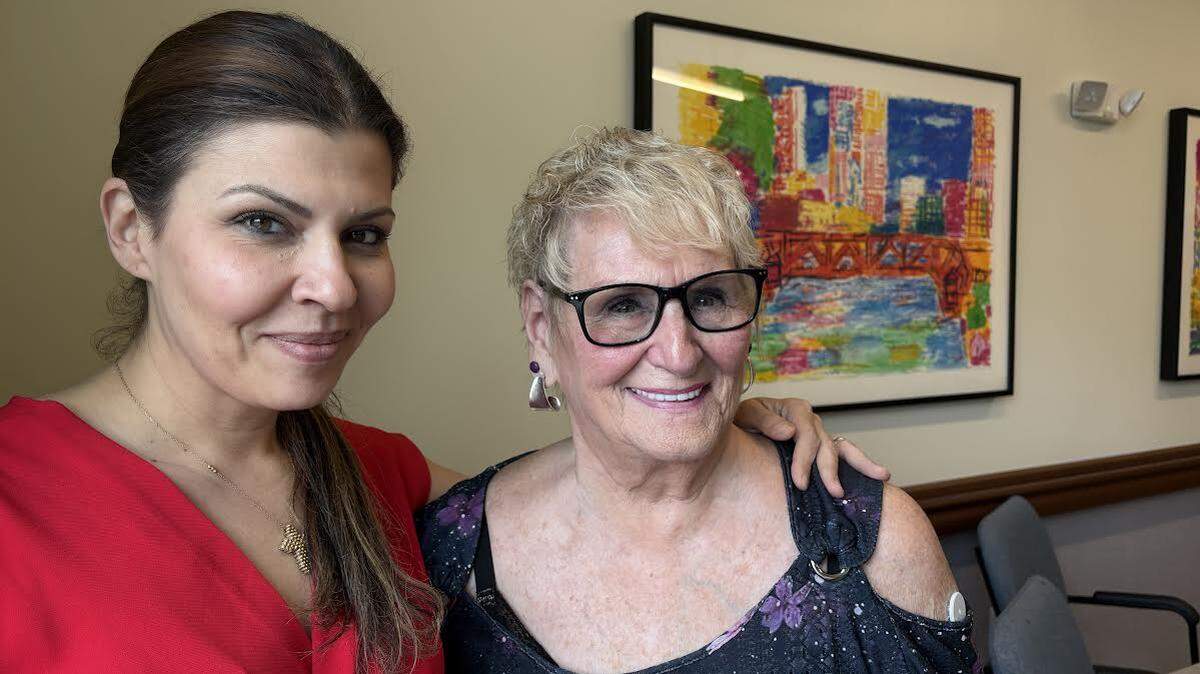 Rachel Nassif, day center director at the PACE Organization of Rhode Island, with program participant Roberta Rabinovitz. Rabinovitz goes to the center, in East Providence, for all her medical care, and an occasional lunch. PACE also set her up with a studio apartment in an assisted living facility in Bristol.