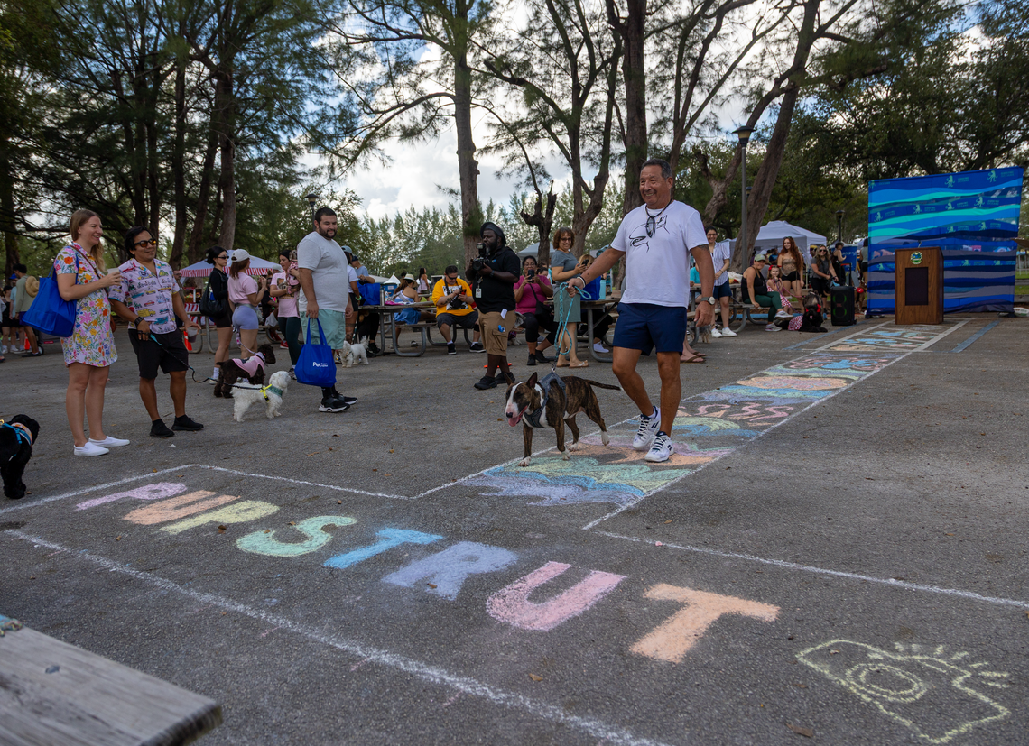 Jauer Garcia and his dog Billy walk the “pup strut” for the best dog and owner lookalike contest at Tropical Park on Sunday. The event reminded people to pick up their dog poop to help keep South Florida’s water clean.