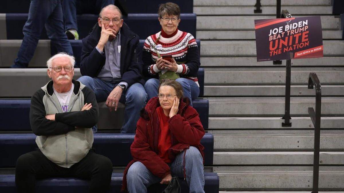 Joe Biden supporters in Iowa await caucus results. They had a long wait to find out their candidate came in fourth.