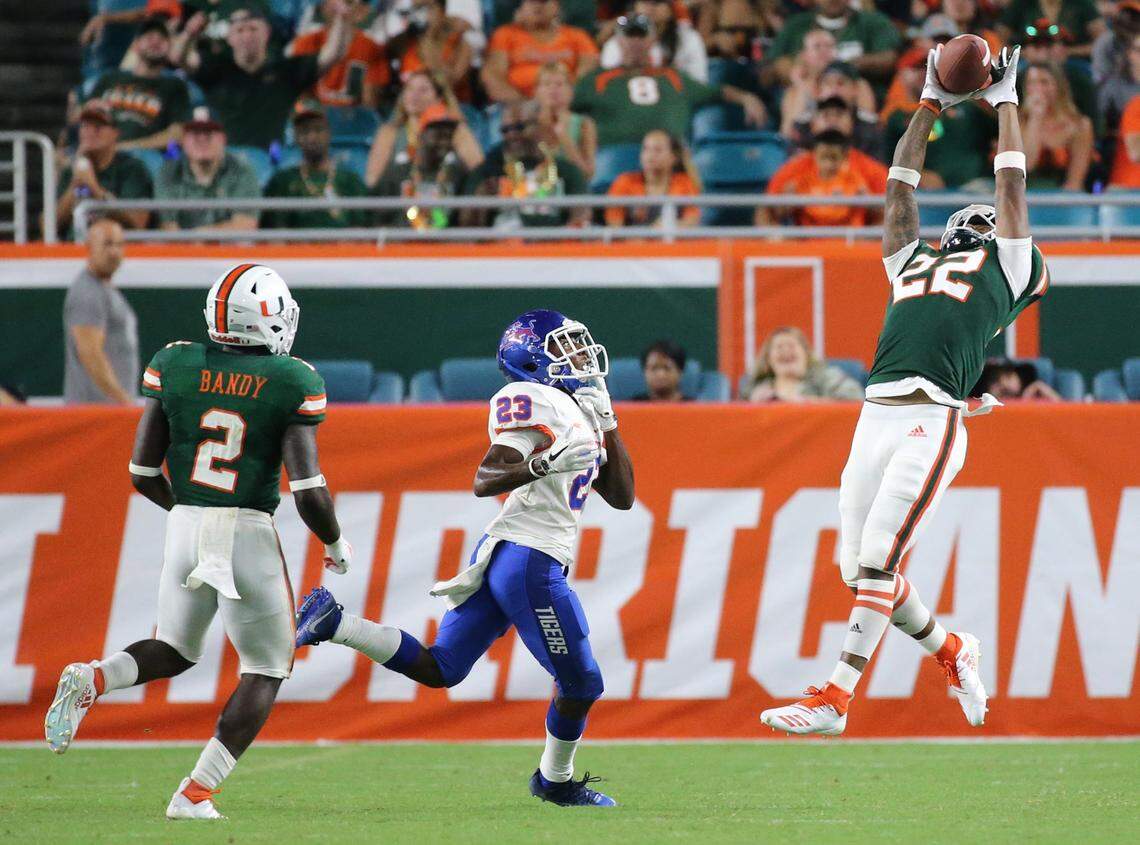 Miami Hurricanes defensive back Sheldrick Redwine (22) intercepts in the third quarter as the University of Miami hosts Savannah State at Hard Rock Stadium in Miami Gardens on Saturday, September 8, 2018.