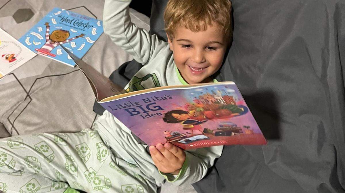 Galina Ilcheva says she reads multiple books with her 4-year-old son David each night since he started receiving a free book a month through The Children’s Trust Book Club. One of David’s most recent favorites is ‘Little Nita’s Big Idea’ by Anna W. Bardaus. Photo provided to the Miami Herald by Galina Ilcheva.