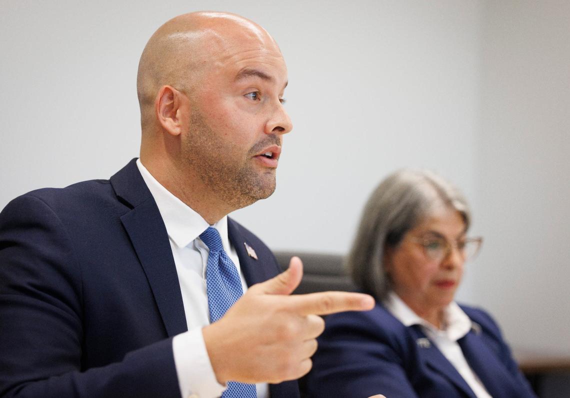 Manny Cid, current Miami Lakes mayor, left, speaks while Mayor Daniella Levine-Cava listens during the Miami Herald Editorial Board’s meeting with candidates for upcoming Miami-Dade mayor election on Wednesday, July 17, 2024 at the Miami Herald office in Miami.