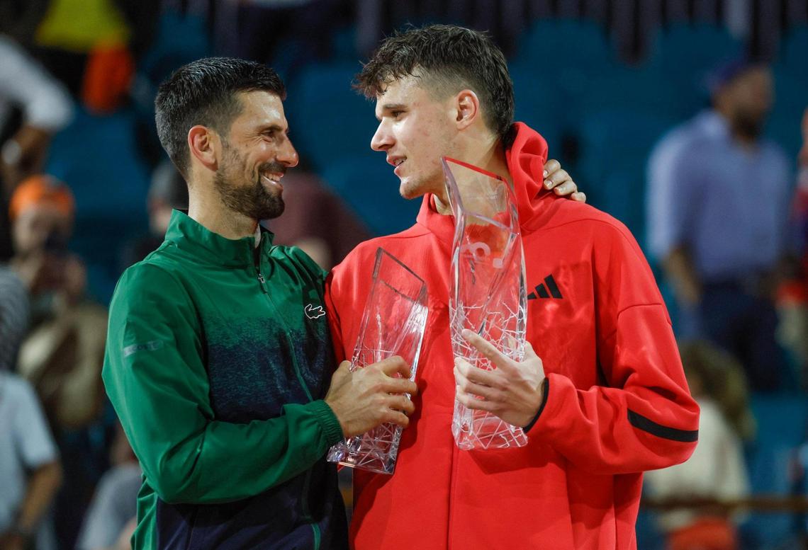 Novak Djokovic congratulates Jakub Mensik after Mensik defeats Djokovic in the Miami Open tennis men’s final at Hard Rock Stadium in Miami Gardens, Florida, on Sunday, March 30, 2025.