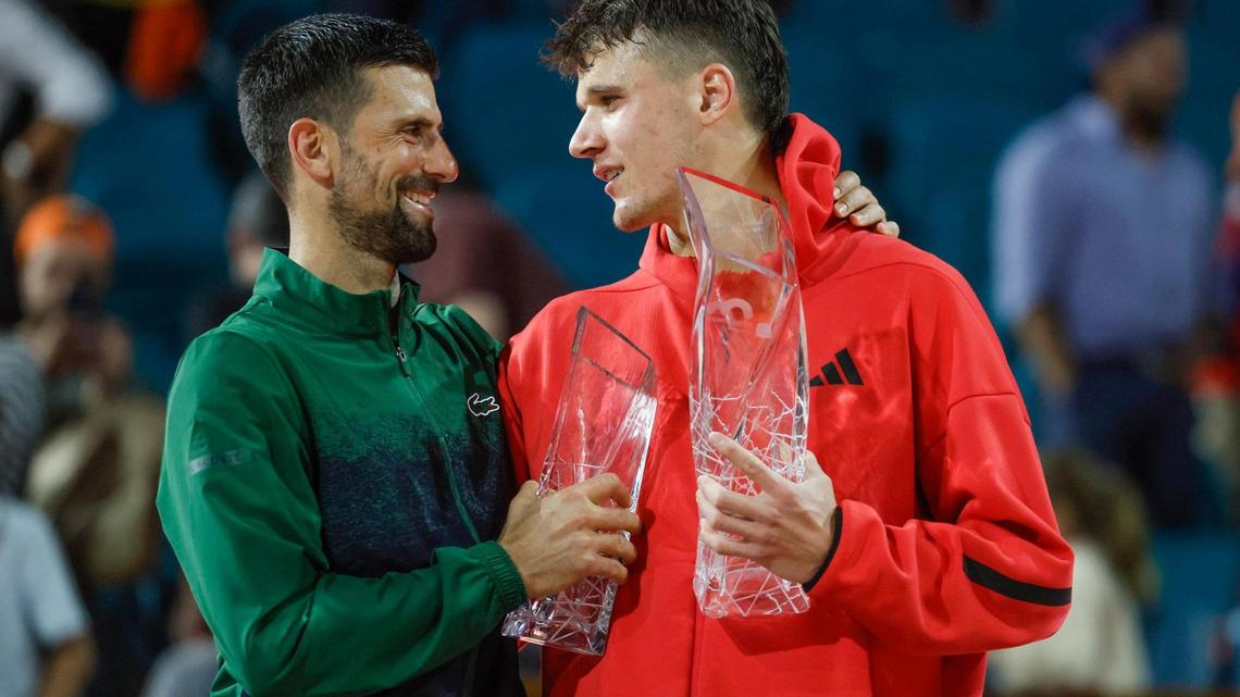 Novak Djokovic congratulates Jakub Mensik after Mensik defeats Djokovic in the Miami Open tennis men’s final at Hard Rock Stadium in Miami Gardens, Florida, on Sunday, March 30, 2025.
