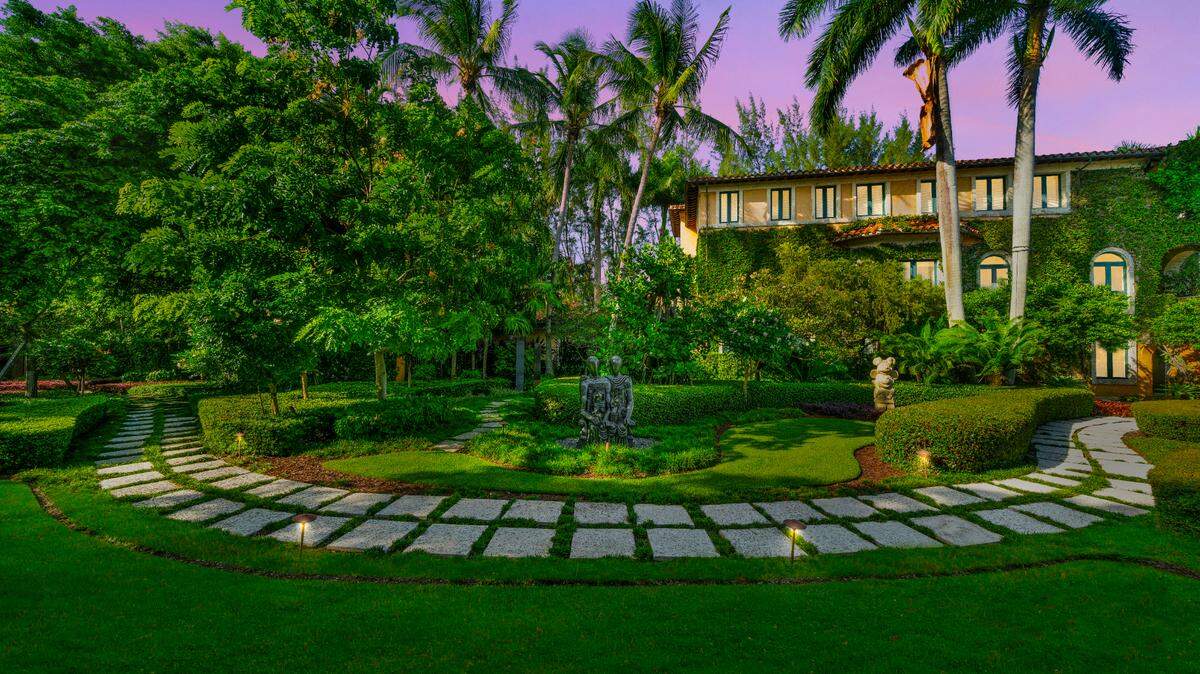 Jorge Pérez listed his Coconut Grove estate, featuring this manicured sculpture garden, for $33 million.