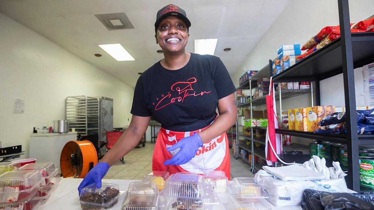 Chef Syerra Donaldson, founder of the catering company EasyCookinWithSy, packs desserts in Miami Gardens on Saturday, May 24, 2025.