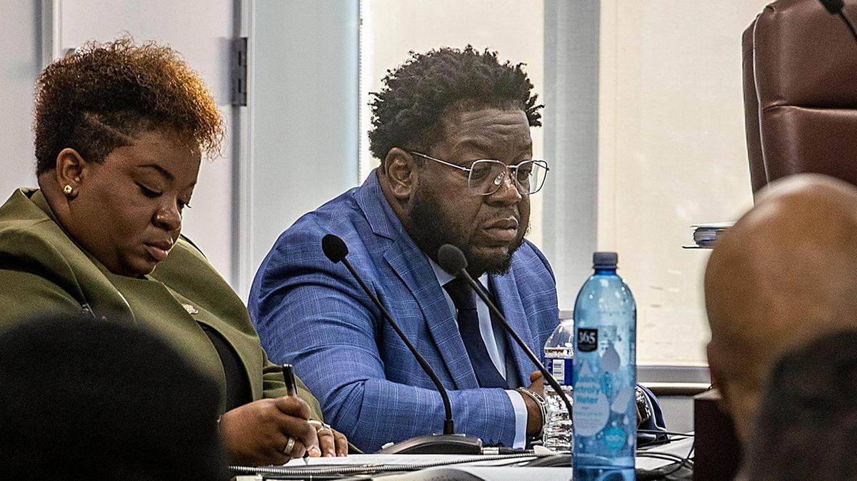 City of North Miami Beach Manager Aid Kemarr Brown, left, sits next to City Manager Arthur H. Sorey III during the first meeting that all commissioners attended since a judge ordered them to do so, on Tuesday, March 21, 2023.